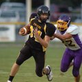 Prairie Grove senior Thomas Soehner tries to elude Lavaca junior Zak McAnally during the first quart...