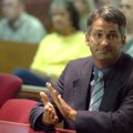 Michael Reagan applauds the jury Friday afternoon after they found him not guilty in his child moles...