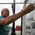 <b>Changing the sign</b>
Volunteer Charley Scott searched for the letter 'V' as he changed the sign...