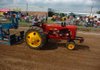 Carl Brown of Siloam Springs rides his Massey Harris 44 in the semis open division Saturday during the tractor pull competition at the Washington County Fair in Fayetteville. 

