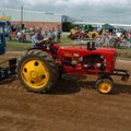 Carl Brown of Siloam Springs rides his Massey Harris 44 in the semis open division Saturday during t...