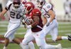 Arkansas sophomore Dennis Johnson returns the opening kickoff for a touchdown during the Hogs' 48-10 win Saturday over Missouri State at War Memorial Stadium in Little Rock. 