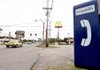 A pay phone in Centerton sits back from the road.