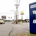 A pay phone in Centerton sits back from the road.