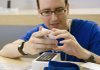 An employee sets up Iphone 3GS for a customer recently in an Apple store in New York.