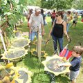Dean Henry of Highlandville, Mo., describes the bird feeders that he and his wife make from used tir...