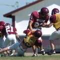 Lincoln's Ezquiel Hernandez (23) is tackles during a scrimmage May 20 in Lincoln.

