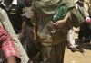 Sudanese journalist and U.N. staffer Lubna Hussein, wearing the same trousers that had sparked her arrest, arrives at the court where she was convicted of violating the public indecency law by wearing trousers outdoors and fined US$ 200, in Khartoum, Sudan Monday.