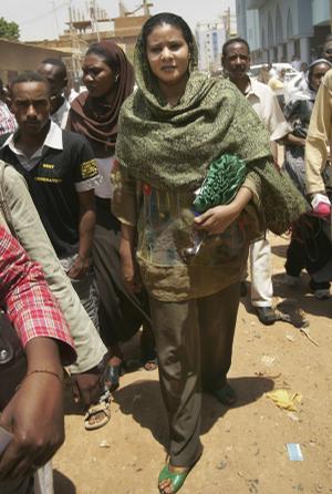 Sudanese journalist and U.N. staffer Lubna Hussein, wearing the same trousers that had sparked her arrest, arrives at the court where she was convicted of violating the public indecency law by wearing trousers outdoors and fined US$ 200, in Khartoum, Sudan Monday.