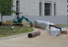 After complaints surfaced about the water sculpture placed outside the new federal courthouse in Little Rock, crews have begun work to install greenery, flower beds and benches around the sculpture over the next four months.