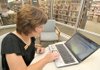 Rogers Public Library Director Judy Casey demonstrated a new tutoring program for adult students in her office in Rogers. 