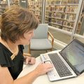 Rogers Public Library Director Judy Casey demonstrated a new tutoring program for adult students in ...