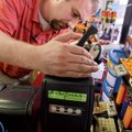 David Wallach, field service manager for Intralot, installs the state's first Arkansas Lottery ticke...