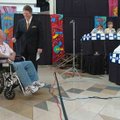 Daren Bobb, KFSM News 5 anchorman, right, talks with Jim Burdick, who was diagnosed with muscular dy...