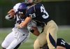  Fayetteville senior receiver Michael Heintzman, left, is tackled by Shiloh Christian junior linebacker Colt Thomas during the first half of a scrimmage Aug. 24 at Shiloh Christian. 

