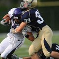  Fayetteville senior receiver Michael Heintzman, left, is tackled by Shiloh Christian junior linebac...