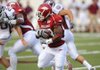 Arkansas sophomore Dennis Johnson returns the opening kickoff for a touchdown during the Hogs' game with Missouri State Saturday at War Memorial Stadium in Little Rock.