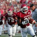 Arkansas' Michael Smith runs for a touchdown during the first quarter of the Hogs' 48-10 win over Mi...
