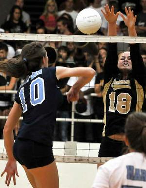 Bentonville's Sydney Thurow blocked a kill attempt by Har-Ber's Kellsie Pullen during Tuesday's 7A-West match at Bentonville High School.