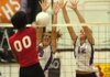 Fayetteville senior Ashleigh Price (19) and senior Sarah Pfitzinger (12) block Northside senior Charmaine Whitmore's shot during the third set Tuesday in Fayetteville. The Lady Bulldogs won 3-0.