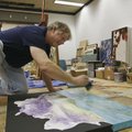 Contemporary artist Robert Glick of Fayetteville works on a painting Wednesday afternoon in his stud...