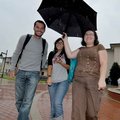 <b>Three's company</b>
Adil Ayadi, left, Sara Mouzabi, center, and Linda Soriana shared an umbrella...