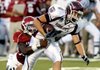 Arkansas defensive back Greg Gatson brings down Missouri State's Jared Emory in the second quarter Saturday at War Memorial Stadium in Little Rock.