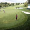 Moira Dunn (r) watches her group putt on the 18th during the Pro-Am Thursday, September 10, 2009 dur...