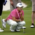 LPGA player Jiyai Shin checks the line on a putt on the 9th green Wednesday during the Pro-Am for th...