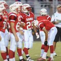 Ramay Junior High coach Craig Foringer works to warm up his team prior to the Indians' game with Woo...