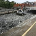 Workers for VCC Construction Co. continue demolishing the parking garage at the Washington County Co...