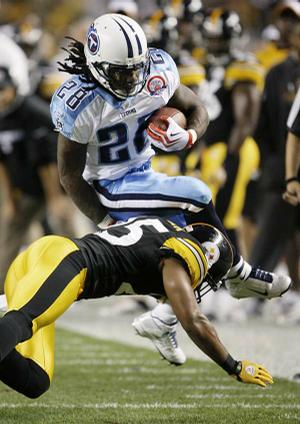 Pittsburgh safety Ryan Clark brings down Tennessee running back Chris Johnson in the first quarter in the Steelers' 13-10 overtime victory Thursday in Pittsburgh.