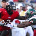 Arkansas State's Reggie Arnold , left, fights off a tackle attempt by Mississippi Valley State's Arm...