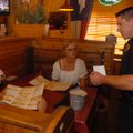 Fayetteville Police Cpl. Travis Lee talks to Mike and Debbie Carey about the Tip-a-Cop program Thurs...