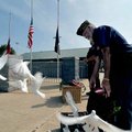Gary Wellesley of Rogers Veterans of Foreign Wars Post 3031 released a basket of white doves during ...