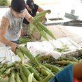 <b>Produce pickup</b>
Cory Foster, left, and Chris Putman, with Daniels Farms, stock ears of corn i...