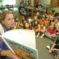 <b>Story time</b>
Kim Buck, a volunteer with the Fayetteville School District, reads a book to firs...