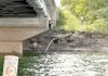 Litter lined the shore and embankment of a popular fishing spot under the Arkansas Highway 12 bridge on
Beaver Lake.