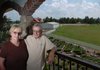 Dr. Frank and Linda Siccardi stand on the balcony of his office at Coenco Inc., a Fayetteville company that manufactures temperature control systems for large open
spaces.