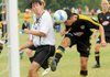 Cesar Merlos, with the five-time state champion Northwest Arkansas Lightning U18 Strikers, headed a corner kick into the goal against El Dorado United at Sugar Creek Soccer Park in Bella Vista on Sunday. The Lightning defeated El Dorado 7-0 in the match. 