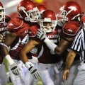 Arkansas sophomore safety Tramain Thomas, center, celebrates making an interception during the third...