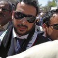Muntadhar al-Zeidi, center, an Iraqi reporter who threw his shoes at former President George W. Bush...
