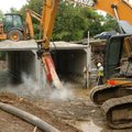 <b>Hammering away</b>
Workers with Crowder Construction use a jack hammer to get to a water line Mo...