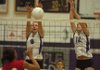 Fayetteville junior Morgan Cosby (8) and senior Sarah Pfitzinger (12) reach to block a kill by Fort Smith Northside junior Mannasha Bell during the third set of the Lady Dogs' 3-0 win Sept. 8 at Fayetteville High. 