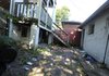 The yard where a Johns Hopkins University student armed with a samurai sword killed an intruder in his garage is shown, Tuesday, Sept. 15, 2009 in Baltimore, Md. T