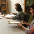 Local residents Bernice Harner, from right, Elizabeth Ashworth and Laura Williams vote early on Faye...