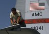 In this August 13 file photo, Technical Sgt. Eric Howard, a crew chief from the 455th Expeditionary Aircraft Maintenance Squadron/C- 130 Aircraft Maintenance Unit, checks the wing of the aircraft for cracks or any problems.