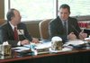 Arkansas Teachers Retirement System Executive Director George Hopkins listens to Dr. Richard Abernathy, chairman of the system's board of trustees, during a discussion about the definition of "termination" at the board's meeting Tuesday.