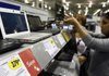 A customer looks at laptops earlier this month at a Best Buy store in Chicago.