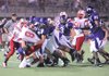 Fayetteville senior linebacker Gareth Booth (84) tackles Jefferson City junior quarterback Sam Turner (8) in the fourth quarter of the Dogs' 20-18 loss Friday at Harmon Field. 